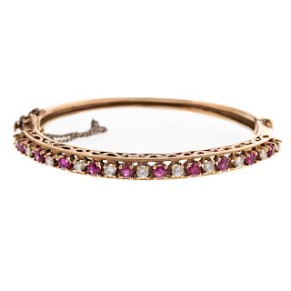 A Ladies Ruby & Diamond Bangle Bracelet in 14K