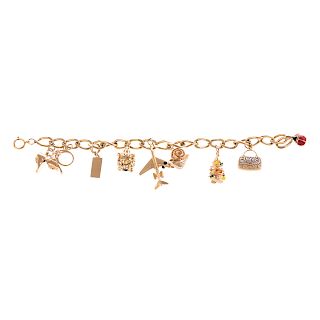 A Ladies 14K Oval Link Bracelet with Eight Charms