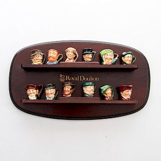 12 TINY ROYAL DOULTON CHARACTER JUGS WITH WALL STAND
