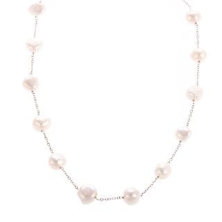 A Ladies Baroque Pearl Station Necklace in 14K