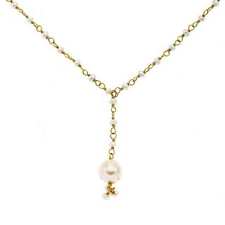 Collar con perlas y oro amarillo de 14k. Perlas color gris de 1 y 7 mm. Peso: 7.1 g.