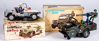 Two Japanese tin battery operated Jeeps