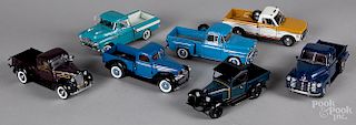 Seven Danbury Mint scale model pick-up trucks