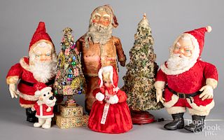 Group of Santa figures and Christmas trees.