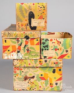 Four Lenci doll boxes.