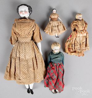Four China and bisque shoulder head dolls