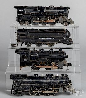 Four Lionel electric train locomotives