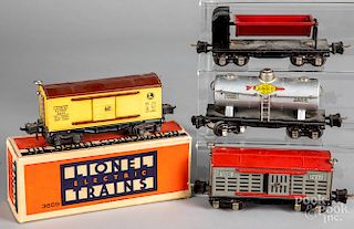 Four Lionel freight train cars