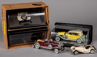 Three Franklin Mint scale model cars