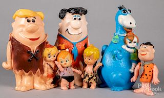Three hard plastic Flintstone bank figures, etc.