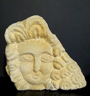 STONE RELIEF HEAD OF A WOMAN