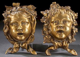 EXCEPTIONAL FRENCH GILT BRONZE MASK PLAQUES