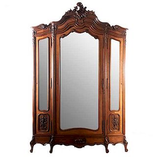 Armario. Francia. SXX. Estilo Luis XV. En madera nogal. Con 3 puertas abatibles con espejos de lunas biselados. 254 x 168 x 51 cm.