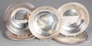 Five sterling silver plates and shallow bowls