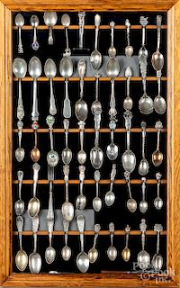 Framed group of sterling silver and plated spoons