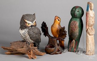 Four carved and painted birds