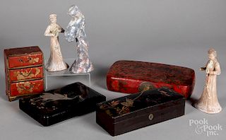 Four pieces of oriental lacquer and three figures