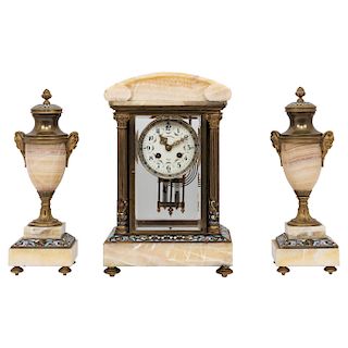 CLOCK GARNITURE. FRANCE, CA. 1900. EMPIRE Style. In gold-colored bronze, brass, champlevé enamel, and marble. Winding mechanism and pendulum. 