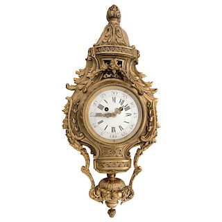 CARTEL CLOCK. FRANCE, CA. 1900. In gold-colored bronze decorated with floral, vegetable, garlands, and vine motifs.