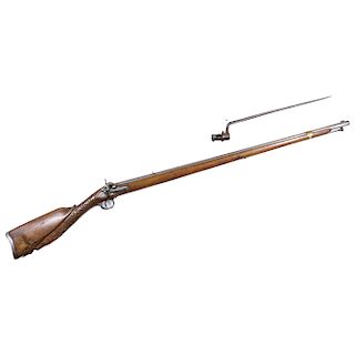 MUSKET WITH BAYONET. BELGIUM, LATE 18TH CENTURY. In steel and wood with caplock mechanism.