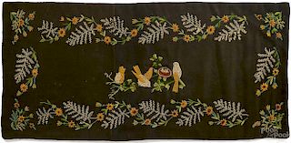 Embroidered table runner, 20th c., with a bird's
