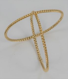 Pair of 18 Karat Gold Bangle Bracelets, twist design, signed AGA. circumference 8 inches. 34.3 grams.