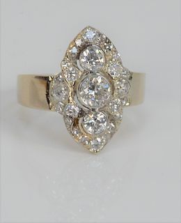 18 Karat Gold and Diamond Ring, set with three diamonds surrounded by twenty-two diamonds, size 7 1/2.