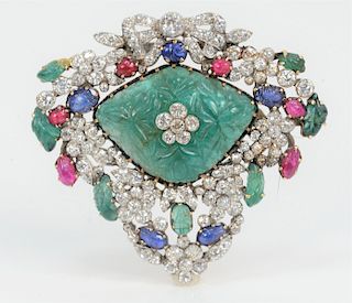 Platinum and 14 Karat Gold Large Brooch, mounted with center shaped emerald (32 x 24 x 14 millimeters), seven emerald leaves (6-10 millimeters), six r