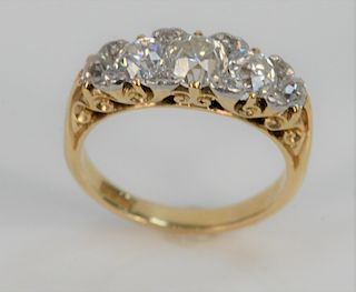 Five Stone Diamond Ring in 18 Karat Setting, center diamond. approximately .75 carats, size 8.