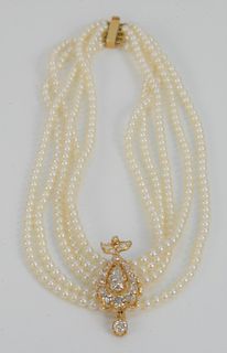 Cultured Pearl and Diamond Necklace, having five strands of cultured pearls set with a detachable old mine cut diamond, brooch set with teardrop and r