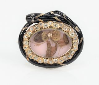 Victorian Gold Brooch, with several hair samples surrounded by twenty- nine mine cut diamonds with enameled snake surround, marked on back Rev. Dr. Ch