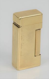 Dunhill Cigarette Lighter, with 14 karat gold outer jacket, monogrammed EFL.