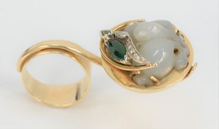 14 Karat Gold Designer Ring, having large round gold bowl set with carved white jadeite, marquis emerald and diamonds. width 2 inches, size 7, 17.3 gr