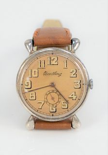 Breitling Mens Vintage Wristwatch, having tan dial and second hand. 35.3 millimeters.