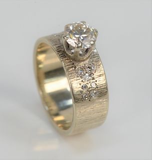 14 Karat White Gold Band Set, with diamond, approximately one carat inset with seven diamonds on either side. size 6 1/2.