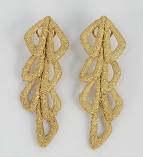 Pair of 18 Karat Gold Clip on Earrings, marked with hallmarks. 30 grams.