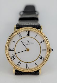 Baume and Mercier Gold Mens Wristwatch, in original box. 33.6 millimeters.