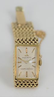 Movado 14 Karat Gold Ladies Wristwatch, with 14 karat mesh band, dial marked Grant A. Peacock in original box. total weight 34.9 grams.