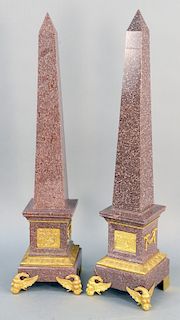 Pair of Large Neoclassical Style Obelisks, red granite with gilt bronze mounts each with allegorical gilt bronze plaques, a swags on base, raised on e