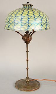 Art Glass Table Lamp, having blue/green favrile shade on patinated bronze single light base with bamboo standard end on circular base marked Tiffany S