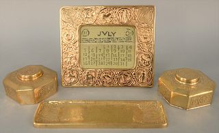 Four Piece Tiffany Desk Lot, Zodiac pattern, to include bronze pen tray, two inkwells and desk calendar, numbers 842 1000 941 each marked Tiffany Stu