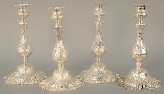 Set of Four Sterling Silver Candlesticks, each of baluster form with rococo decoration, attributed to Redlich and Company NY. height 10 inches, base d
