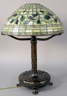 Tiffany Style Swirling Lemon Leaf Table Lamp, leaded glass shade having green and carmel geometric brick border on top and bottom, three rows of green