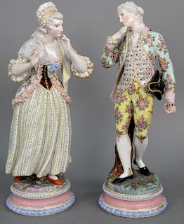 Pair of Meissen Porcelain Standing Figures, 19th century, each wearing floral decorated clothing, standing on round base having under glazed blue cros