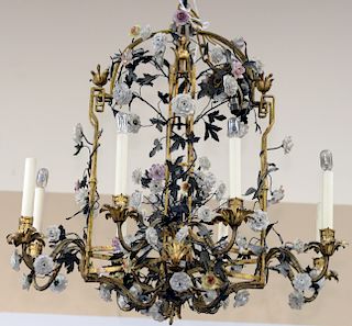 Rare Louis XV Tole and Gilt Metal Chandelier, mounted with porcelain flowers, gilt metal cage work surrounded by numerous tole vines fitted with polyc