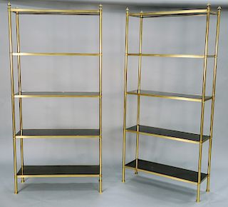 Pair of Maison Jansen Modern Brass Etageres, having five ebonized wood shelves. height 80 1/2 inches, width 30 inches, depth 14 inches. Provenance: An