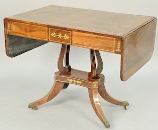 Regency Brass Inlaid Mahogany Sofa Table, one side with three short drawers on a four legged pedestal support, early 19th century (small part of brass