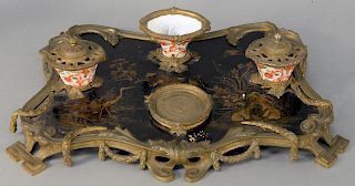 French Chinoiserie Inkwell, having bronze mounted lacquered tray depicting crane in a garden with pond, mounted with porcelain inkwells. length 18 1/2