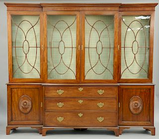 George III Style Mahogany Breakfront Bookcase, with stopped cornice above four glazed doors, over three long drawers flanked by doors decorated with r