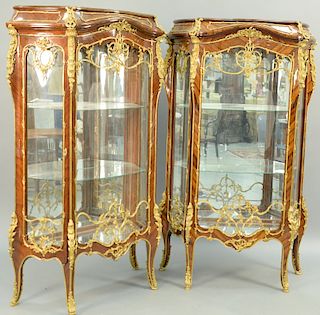 Pair Louis XV Style Kingwood Ormolu Mounted Vitrine Cabinets, late 20th century glass shelves, and side doors. height 71 1/2 inches, width 44 inches, 